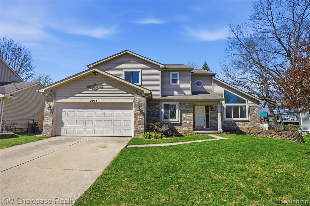 2015 Huntingdon Drive, Wixom, MI 48393 — front exterior