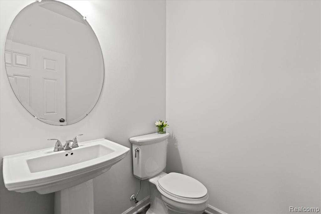 Spare room featuring carpet floors and baseboards