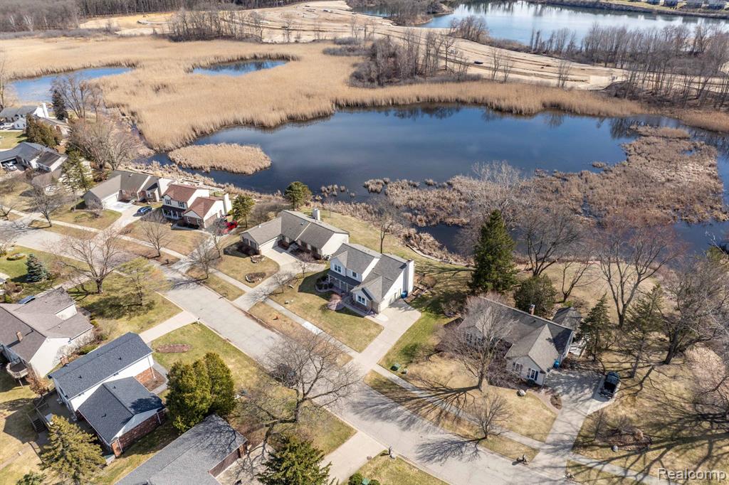 Aerial view of residential area with a large body of water