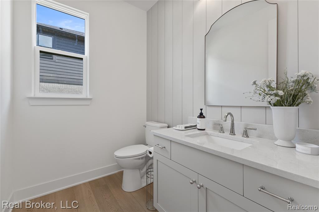 Bathroom with light wood-style flooring and vanity