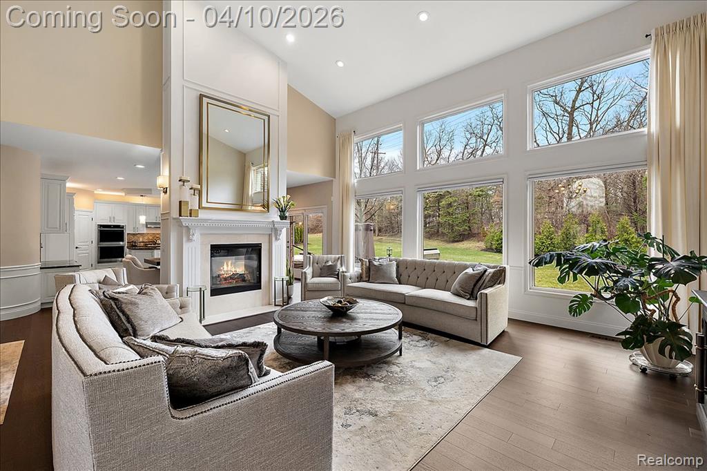 2 Story Living Room w/Double Sided Fireplace & Custom Millwork