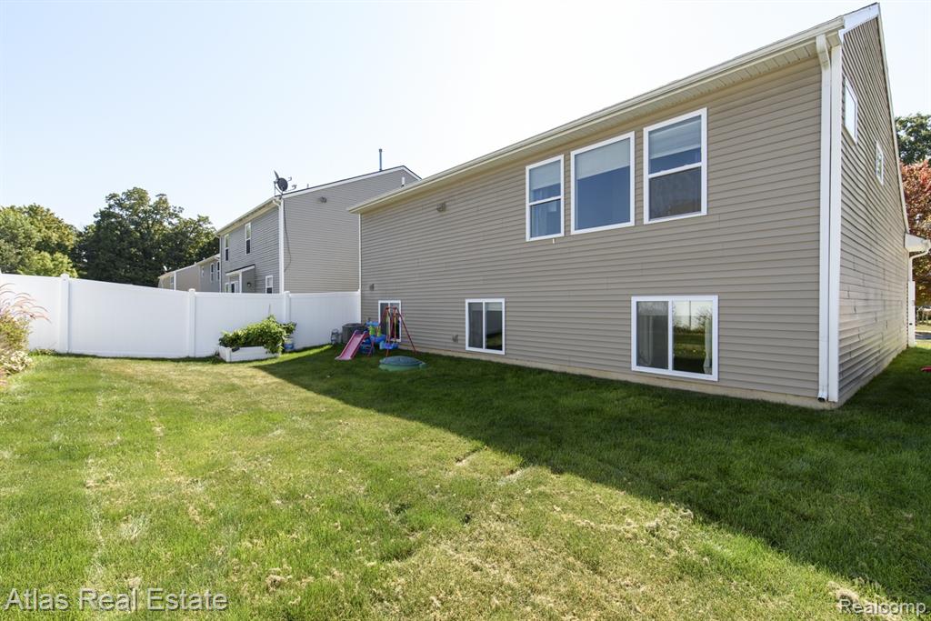 8582 Pinnebog River Drive, Fowlerville, MI 48836 — Photo 3