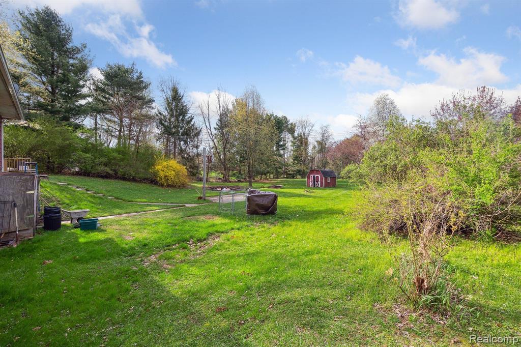 7107 E HIGHLAND Road, Howell, MI 48843 — Photo 17