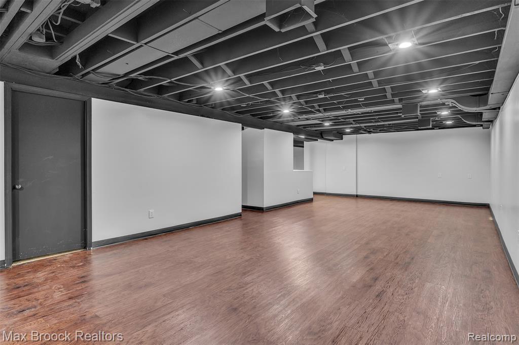 Finished basement featuring wood finished floors
