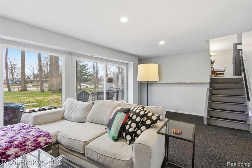 Living room featuring dark carpet and recessed lighting