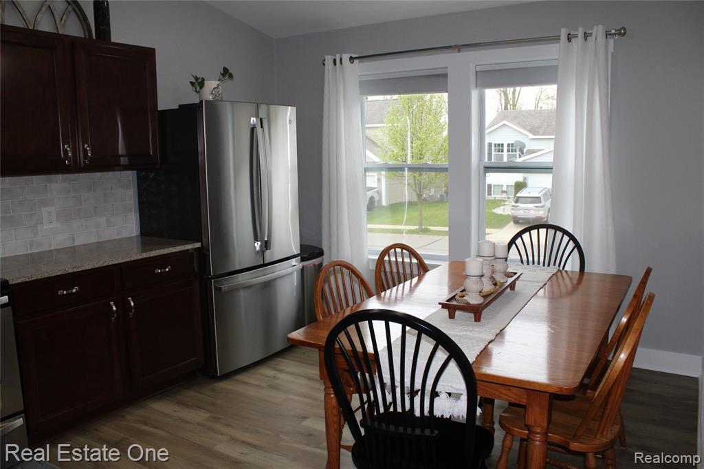 8662 Pinnebog River Drive, Fowlerville, MI 48836 — Photo 11