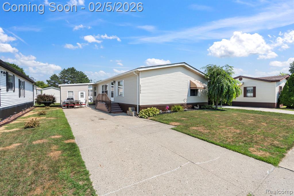 49280 Wildwood Court, Shelby Twp, MI 48315 — front exterior