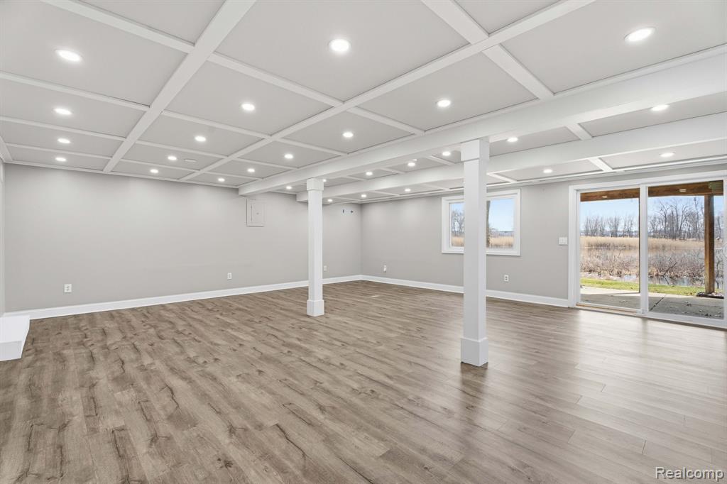 Below grade area with recessed lighting and light wood-type flooring
