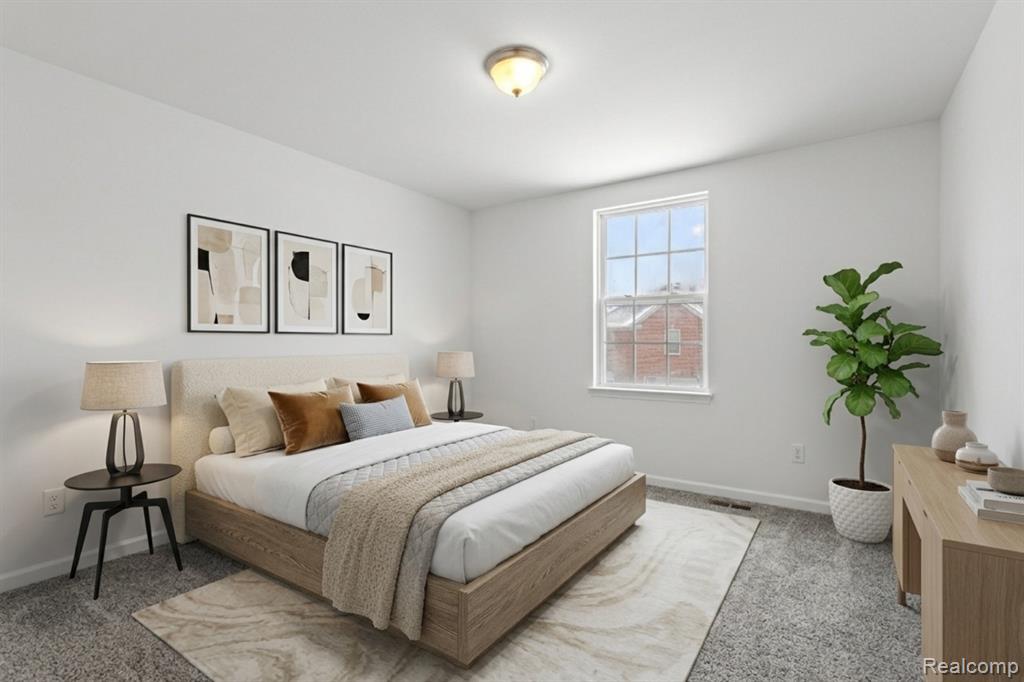 Kitchen with hanging light fixtures, stainless steel appliances, a kitchen island, recessed lighting, and light wood-style flooring