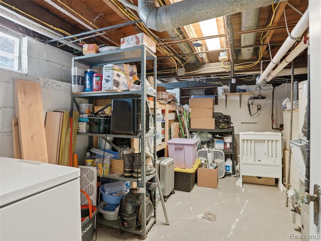 Storage area featuring washer / dryer