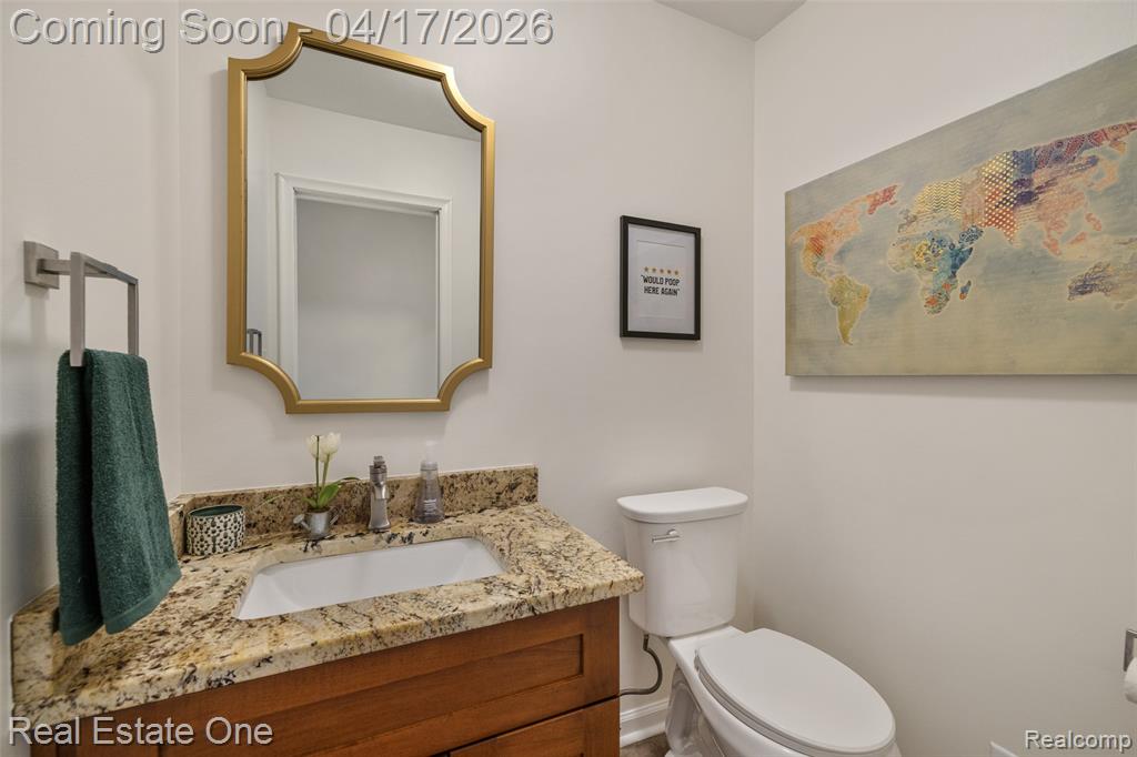 Bathroom featuring vanity and toilet