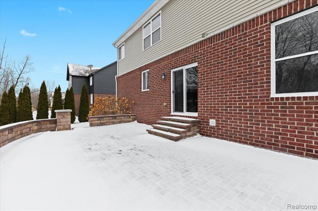 Snowy aerial view featuring a residential view
