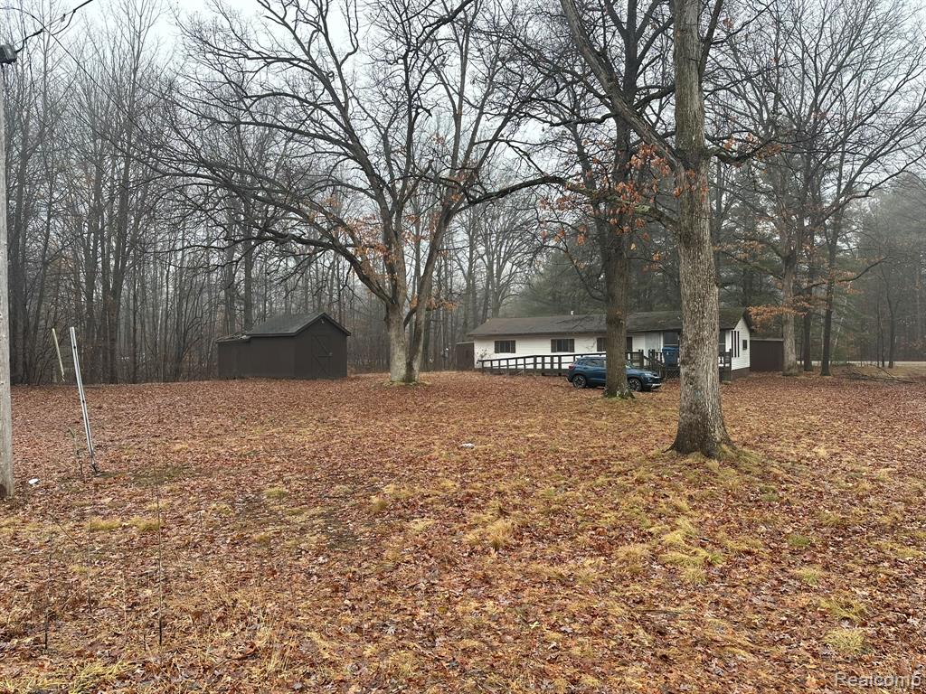 991 W Maplecrest Drive, Sanford, MI 48657 — front exterior