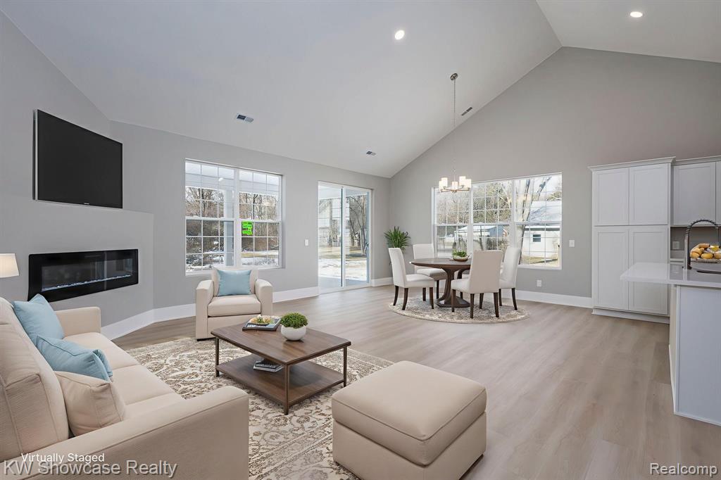 Unfurnished Great Room with Plenty of Natural Light, Fireplace and Vaulted Ceiling, Property Under Construction.