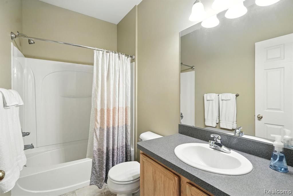 490 Village Drive, Walled Lake, MI 48390 — Photo 16