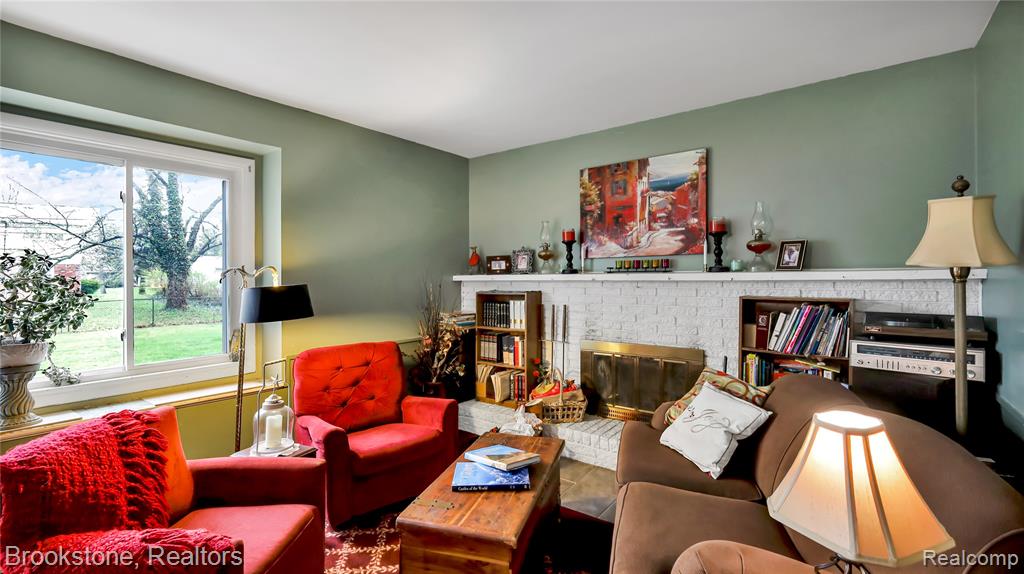 Living room with a brick fireplace