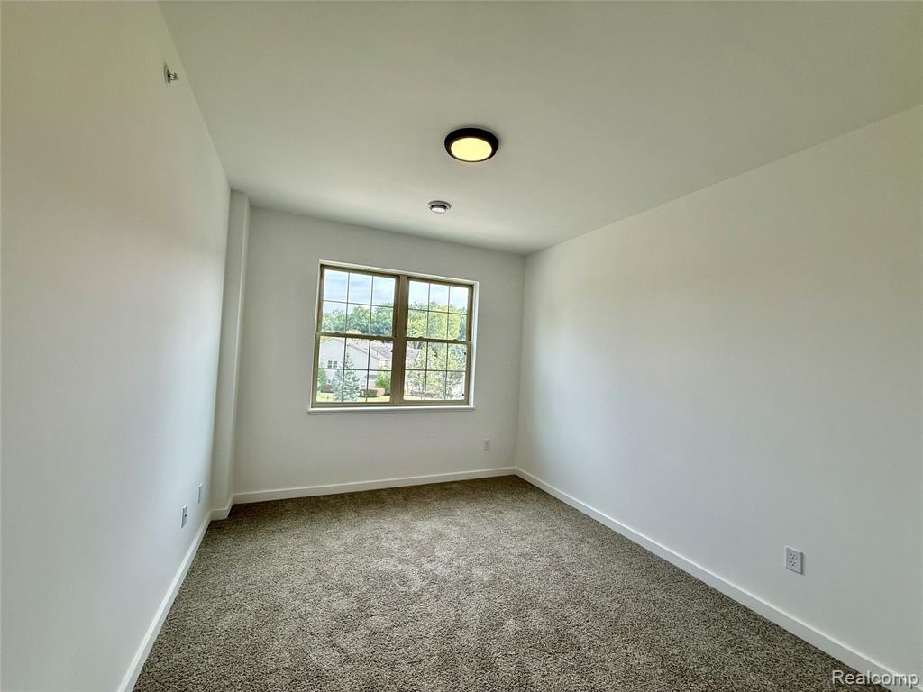 437 Village Drive, Walled Lake, MI 48390 — Photo 16