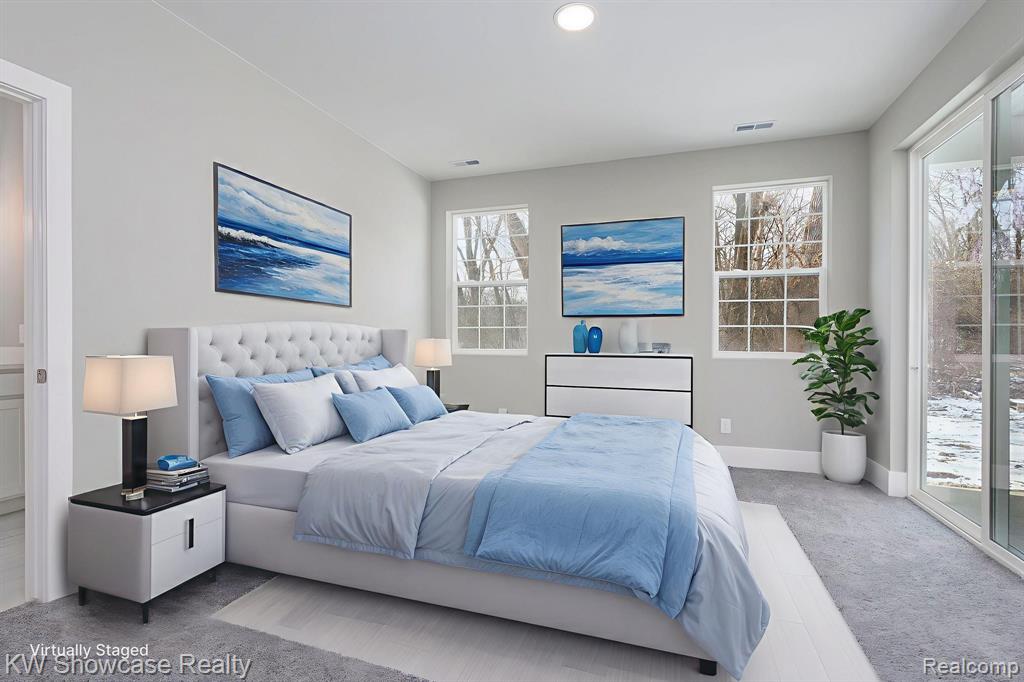 Primary Bedroom with light carpet, access to outside, and recessed lighting.