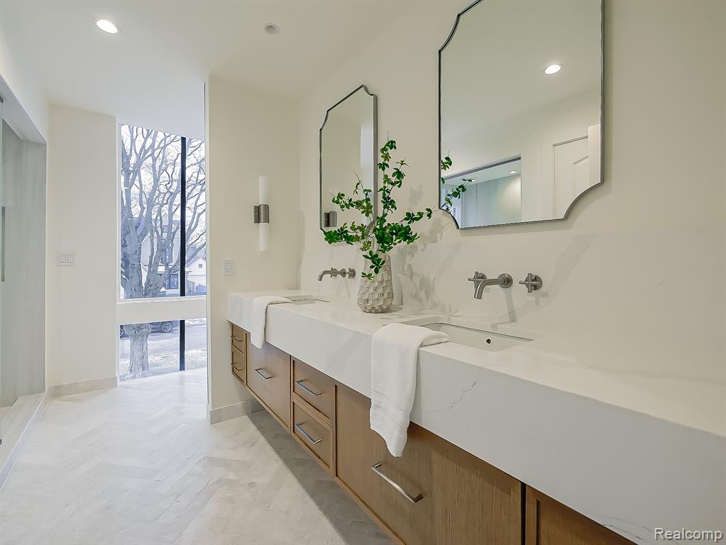 Bathroom with double vanity and recessed lighting