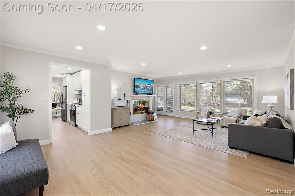 View of Great Room w/Double Sided Fireplace & Fully Renovated Kitchen
