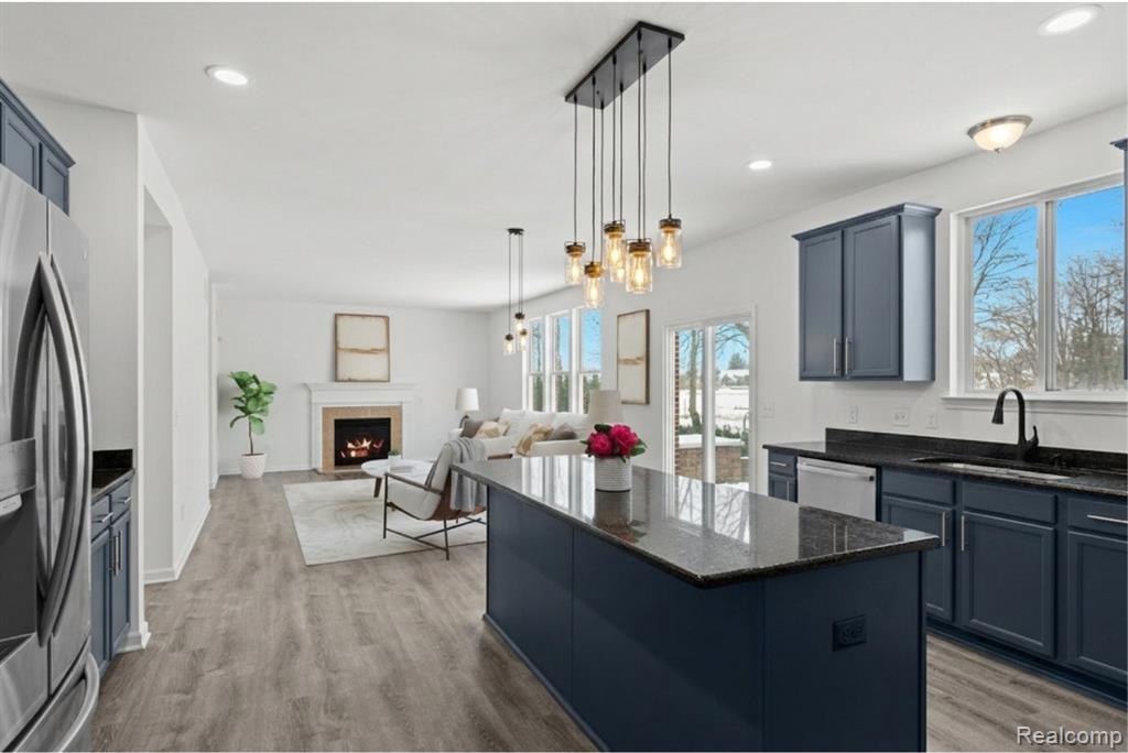 Carpeted spare room featuring baseboards