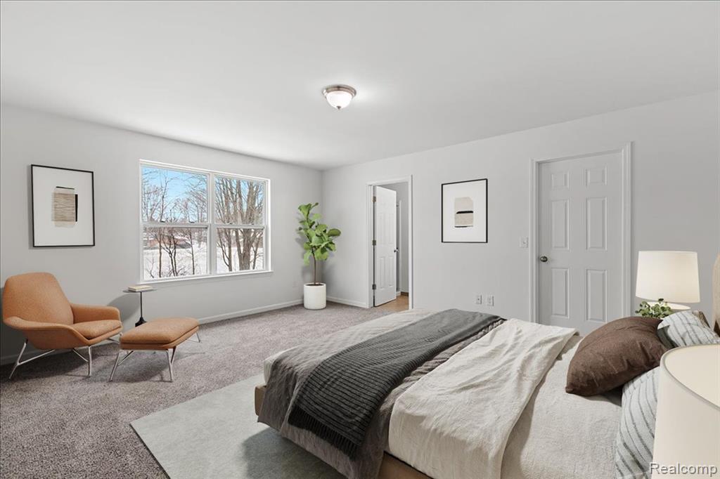 Unfurnished living room featuring dark wood-style floors and baseboards