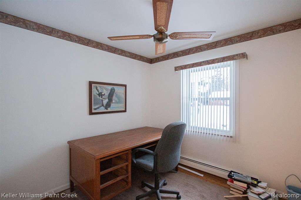 Office area featuring ceiling fan