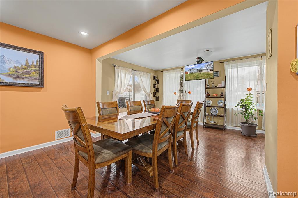 Dining room featuring dark wood-type flooring