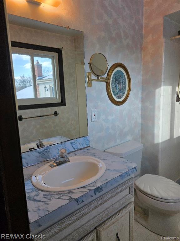 Full bath with vanity and a shower