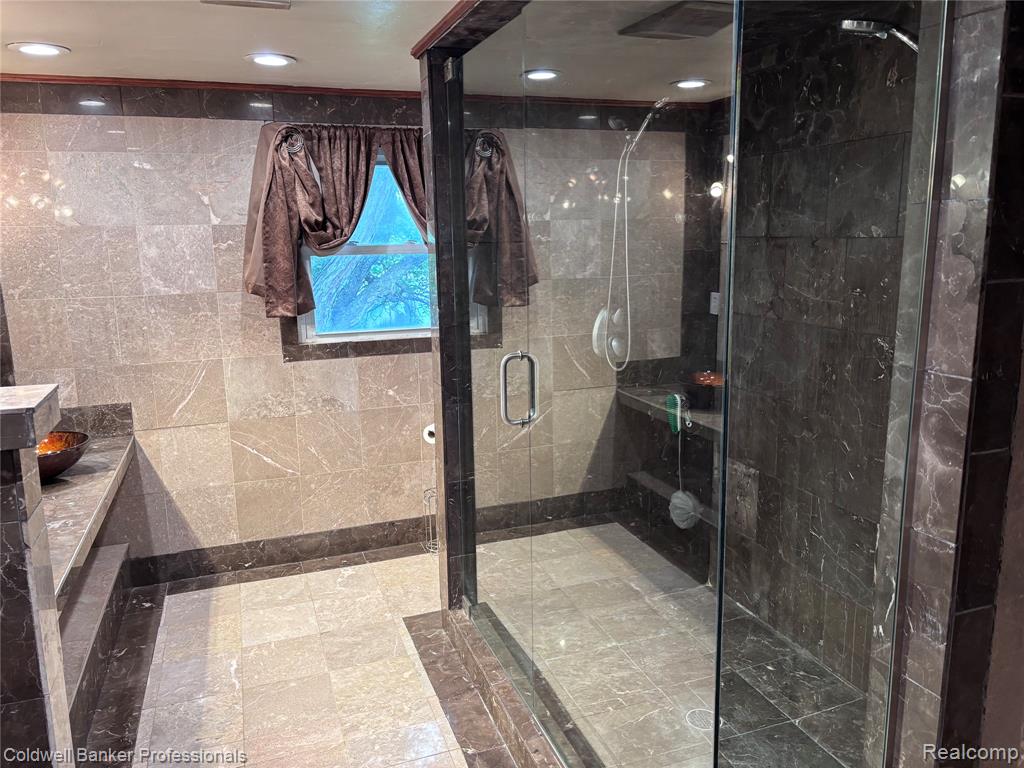 PrimaryBathroom featuring a walk in Shower