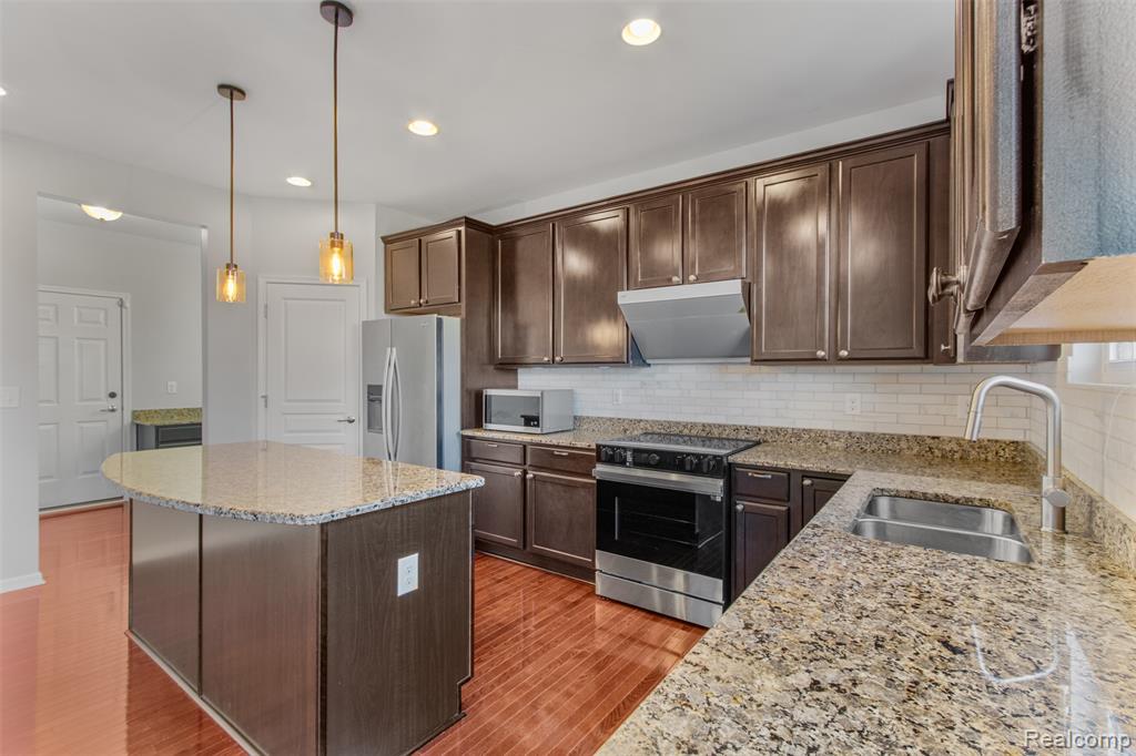 57570 Village Drive, New Hudson, MI 48165 — Photo 17