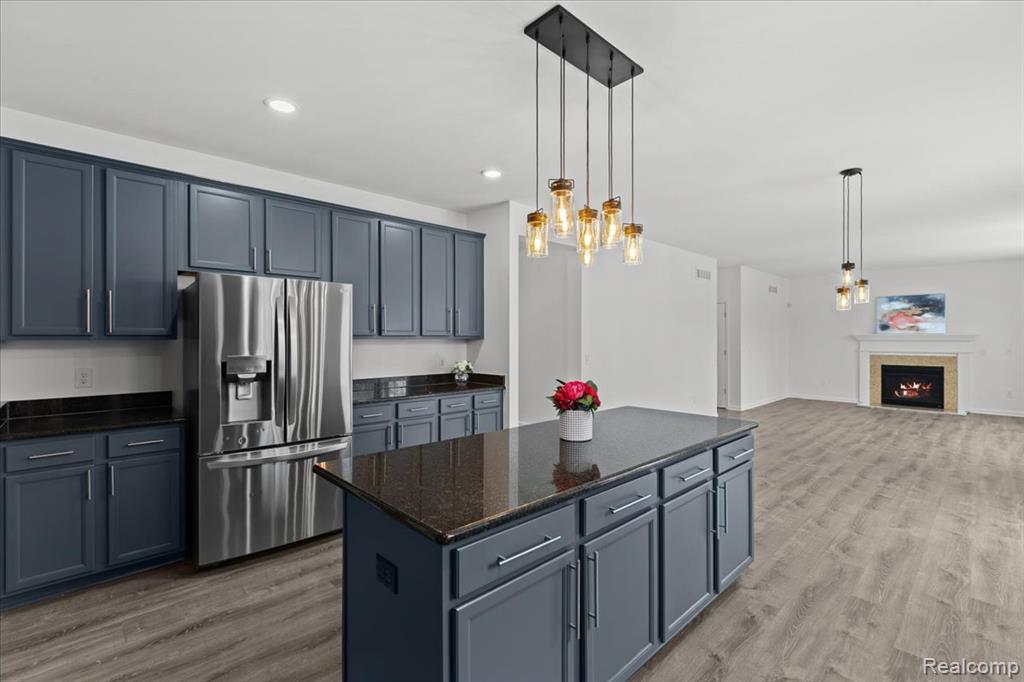 Bathroom featuring double vanity, shower combination, and light tile patterned floors