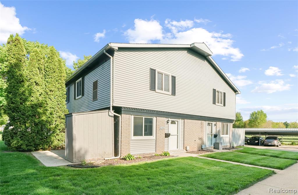 41257 S Woodbury Green Drive, Belleville, MI 48111 — front exterior