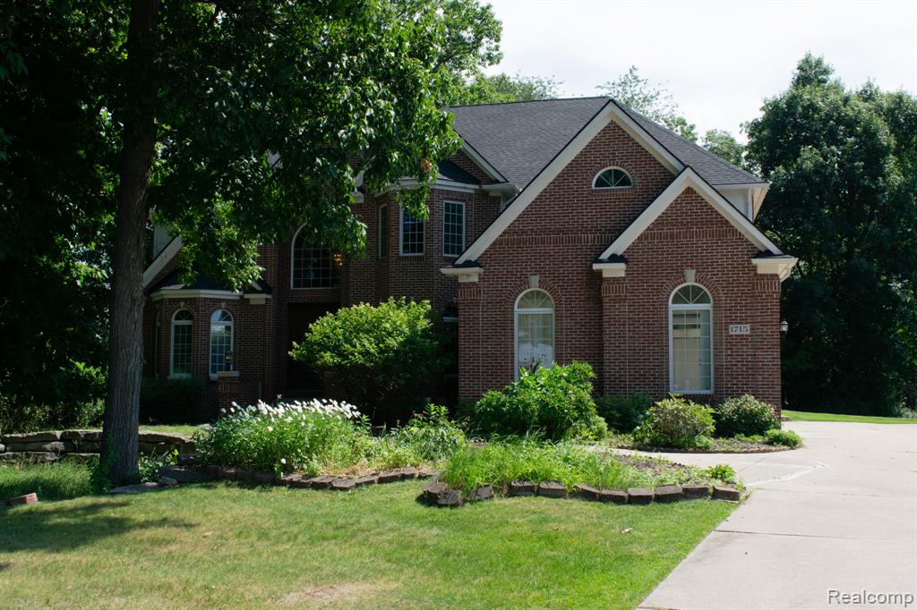 Brick exterior with gabled roof lines and arched windows
