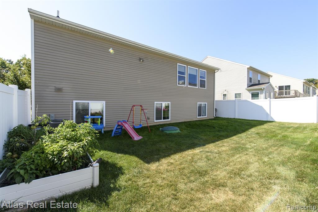 8582 Pinnebog River Drive, Fowlerville, MI 48836 — Photo 4