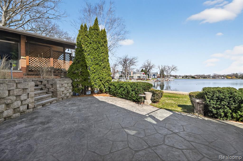 View of patio / terrace featuring a water view