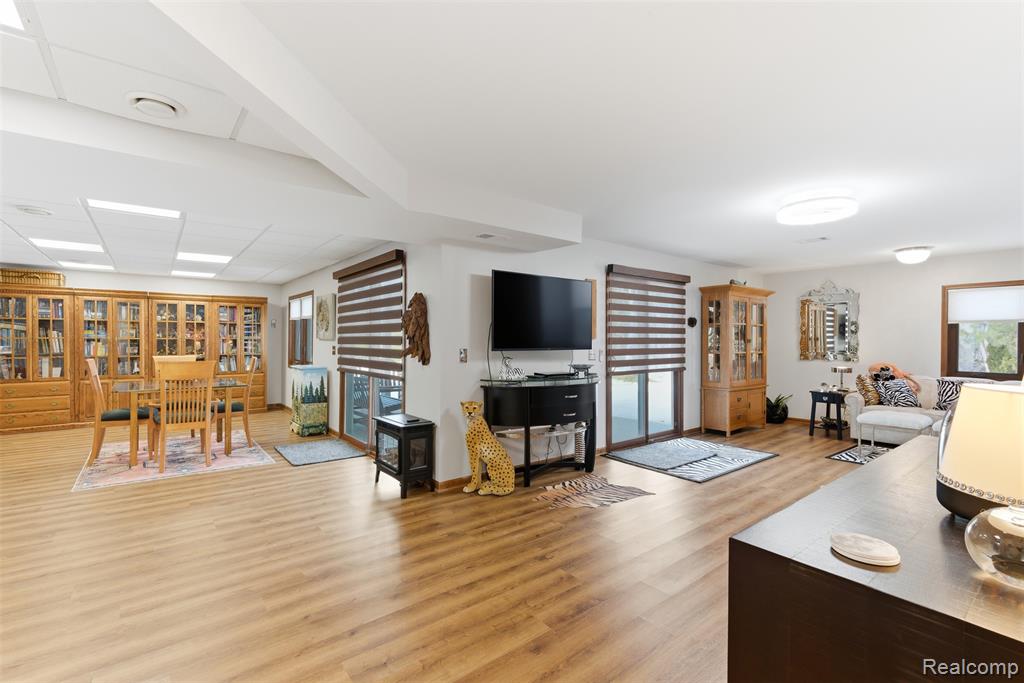 Living area featuring light wood finished floors and baseboards