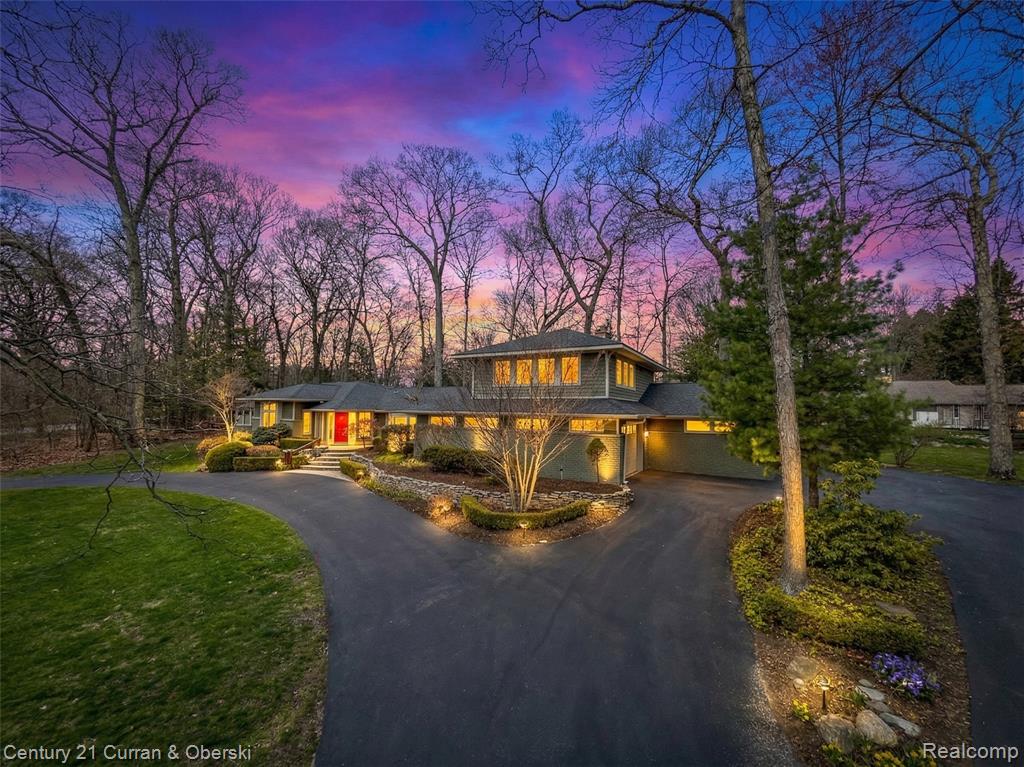 View of front of house featuring driveway and a garage