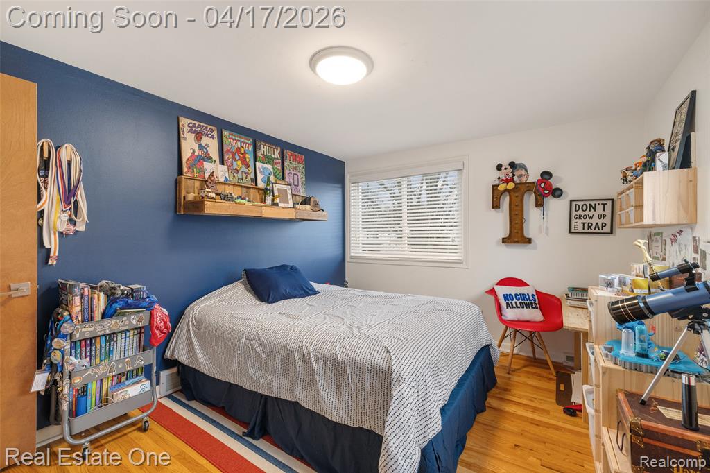 Bedroom with light wood-style floors
