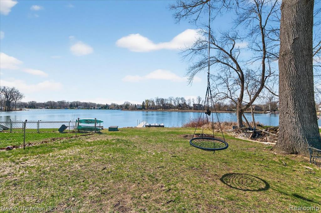 View of yard with a water view