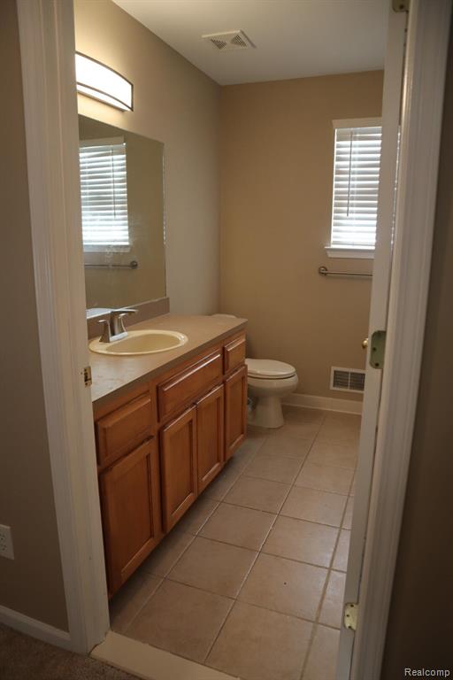 Unfurnished bedroom with a closet and light colored carpet