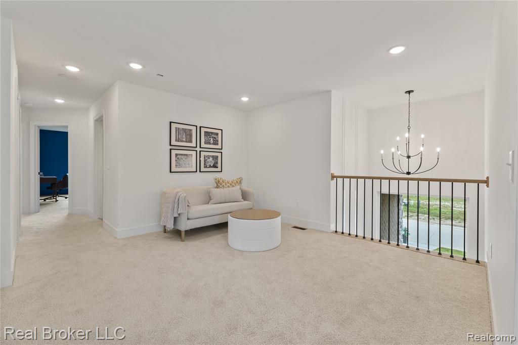 Bedroom featuring carpet flooring and baseboards