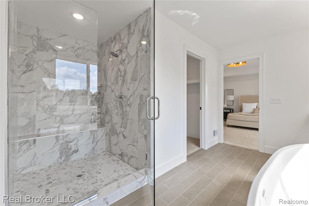 Bedroom with light carpet and recessed lighting