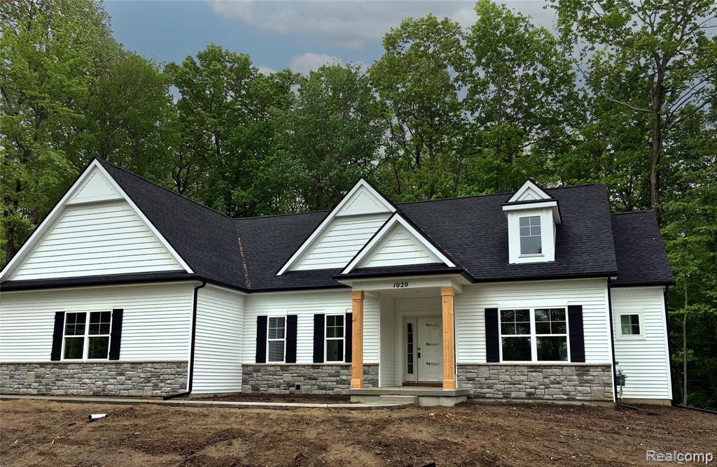 1020 Woods Edge Drive, Hartland, MI 48353 — front exterior