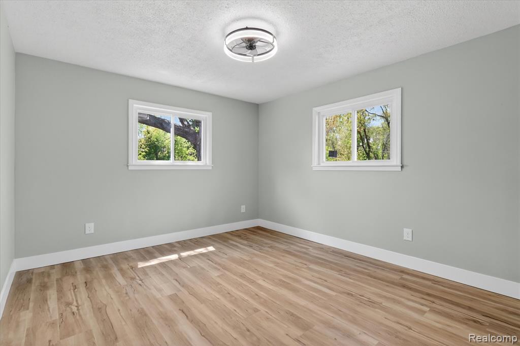 677 Lucille Drive, Wolverine Lake, MI 48390 — Photo 19