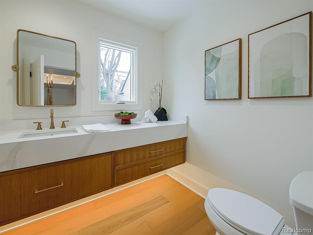 Bathroom featuring vanity and light wood-style floors