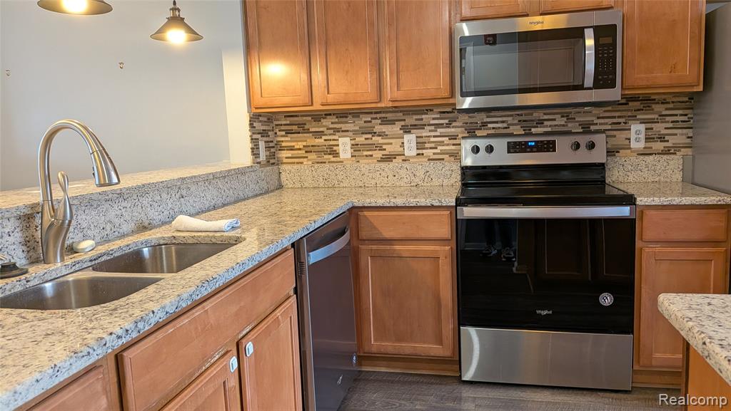 413 VILLAGE Drive, Walled Lake, MI 48390 — Photo 13