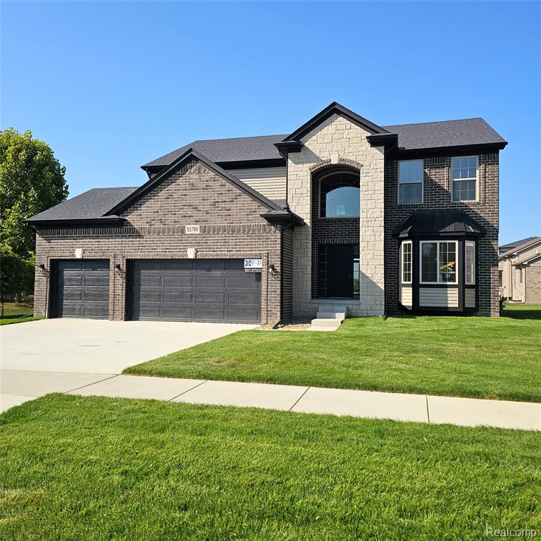 55789 Stewart Drive, Macomb, MI 48042 — front exterior