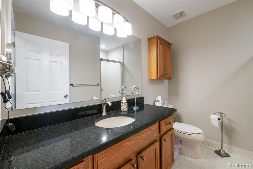 671 Woodhaven Drive, Commerce Twp, MI 48390 — Photo 24
