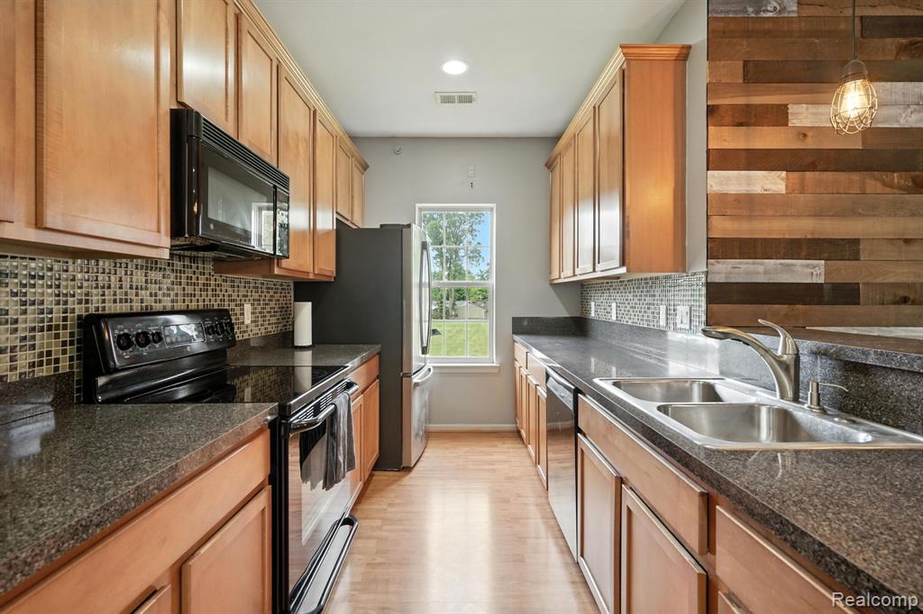 490 Village Drive, Walled Lake, MI 48390 — Photo 11